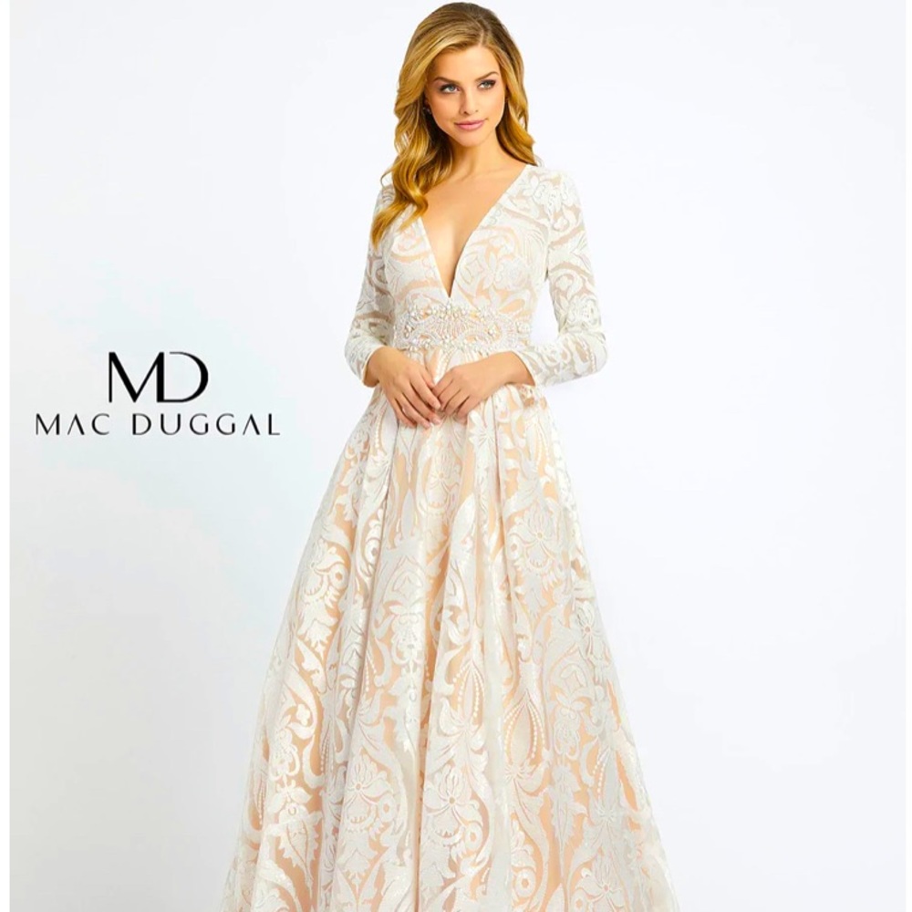 Mac Duggar White long sleeve mesh beaded dress.